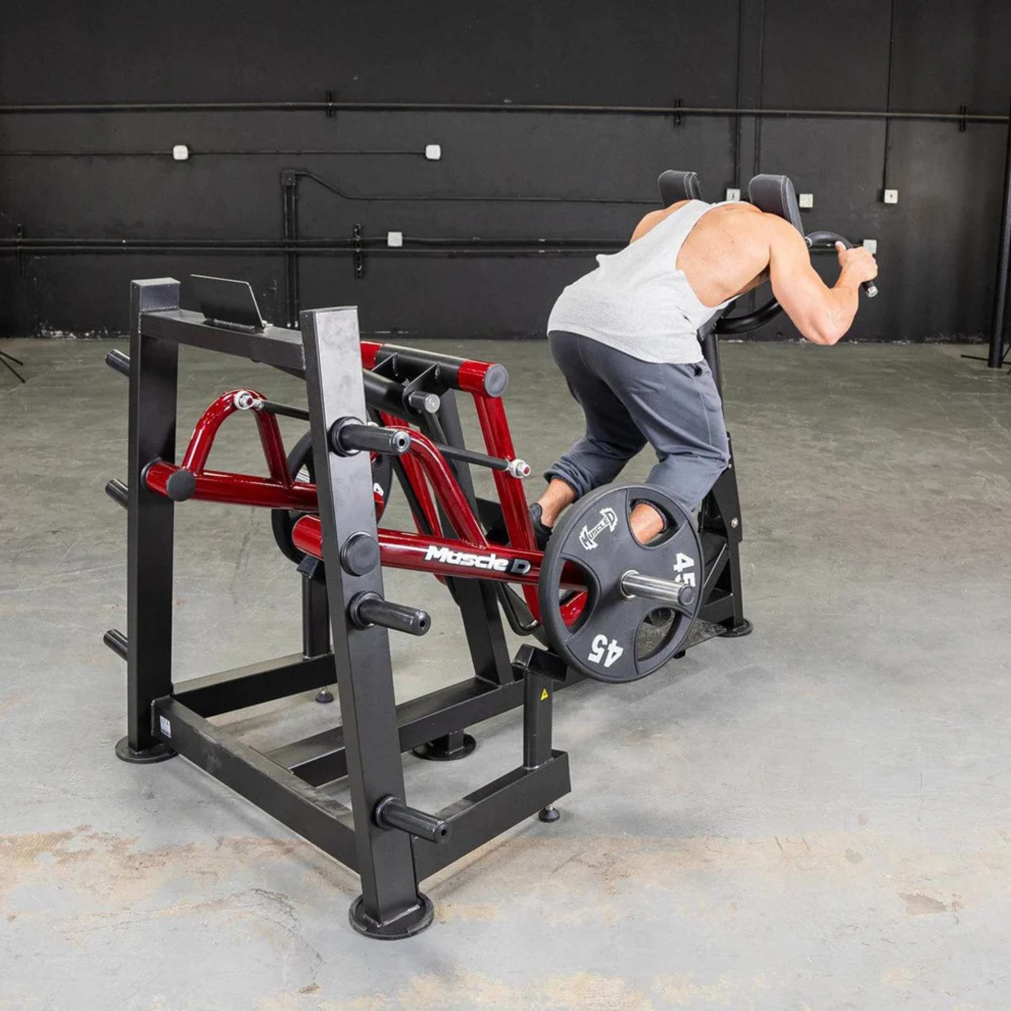 Athlete demonstrating the Muscle D Sprint Trainer PL-PV2-ST with Olympic plates, emphasizing strength and sprint-specific movement.