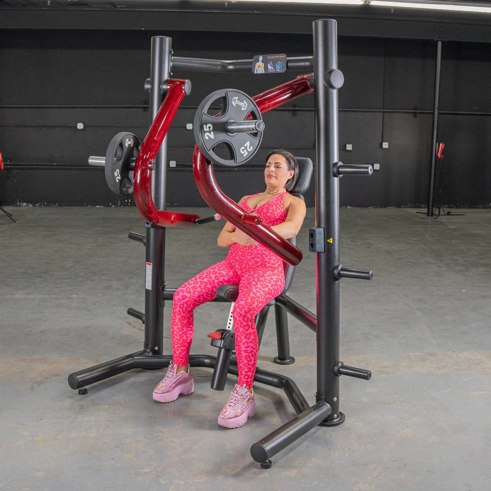 Angle of a person using the Power Leverage V2 Decline Chest Press, focusing on the arm movement and 25 lb plates