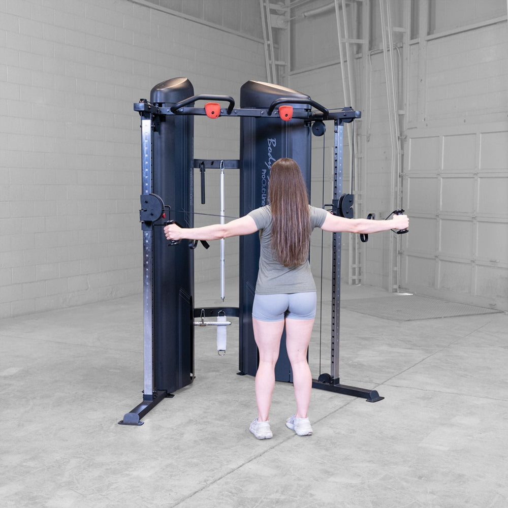 Woman doing rear delt fly on a Body-Solid Pro ClubLine S2CCX Series II Cable Column in black