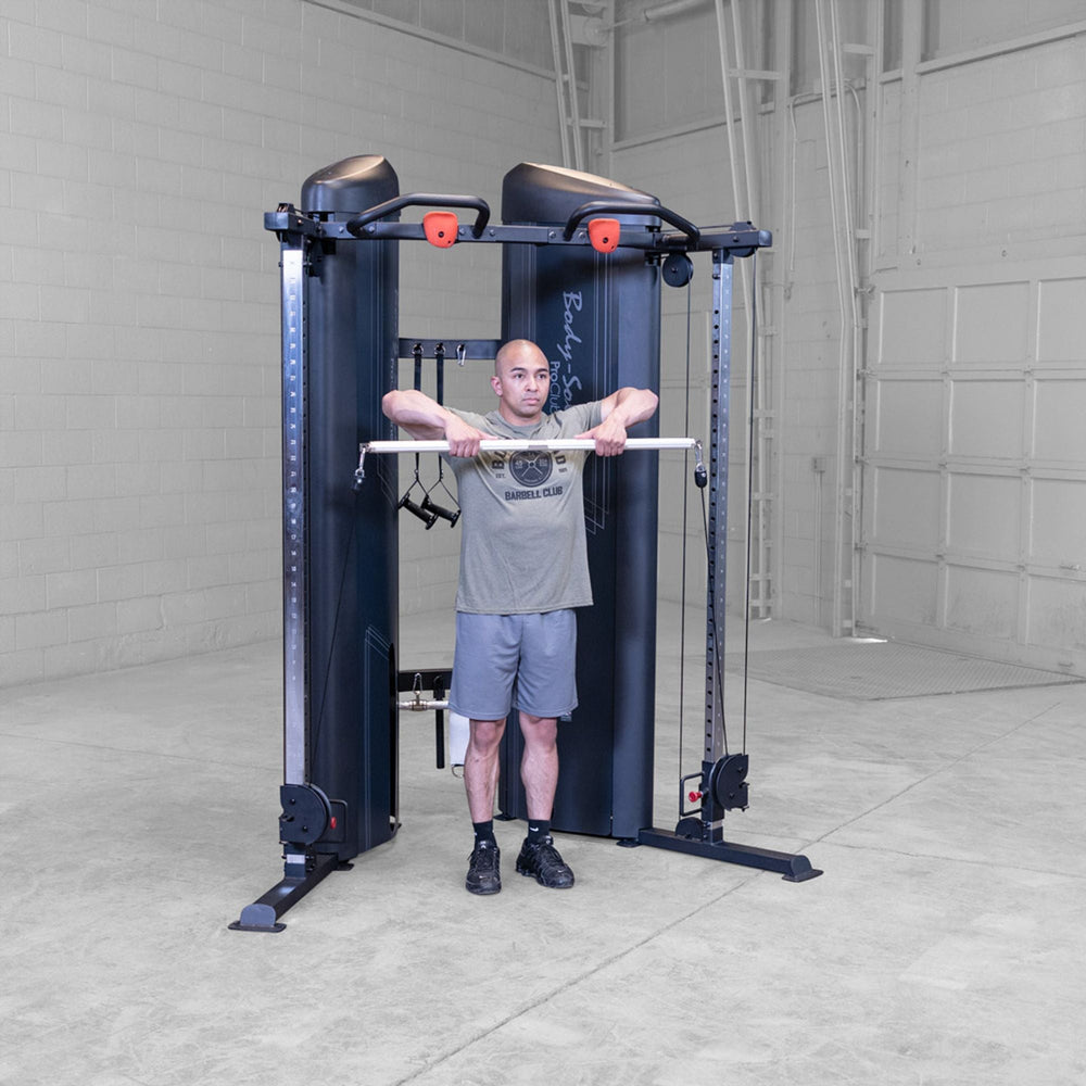 Man doing an upright row using a Body-Solid Pro ClubLine S2CCX Series II Cable Column in black