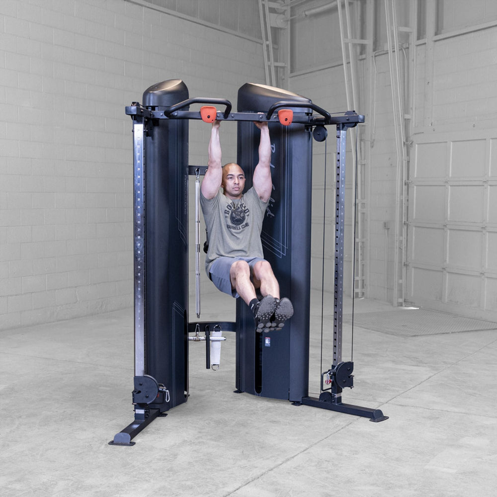 Man doing alternative grip pull ups on a Body-Solid Pro ClubLine S2CCX Series II Cable Column in black