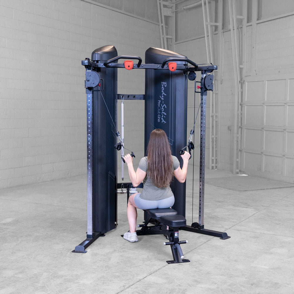 Woman doing lat cable pull downs on a Body-Solid Pro ClubLine S2CCX Series II Cable Column in black