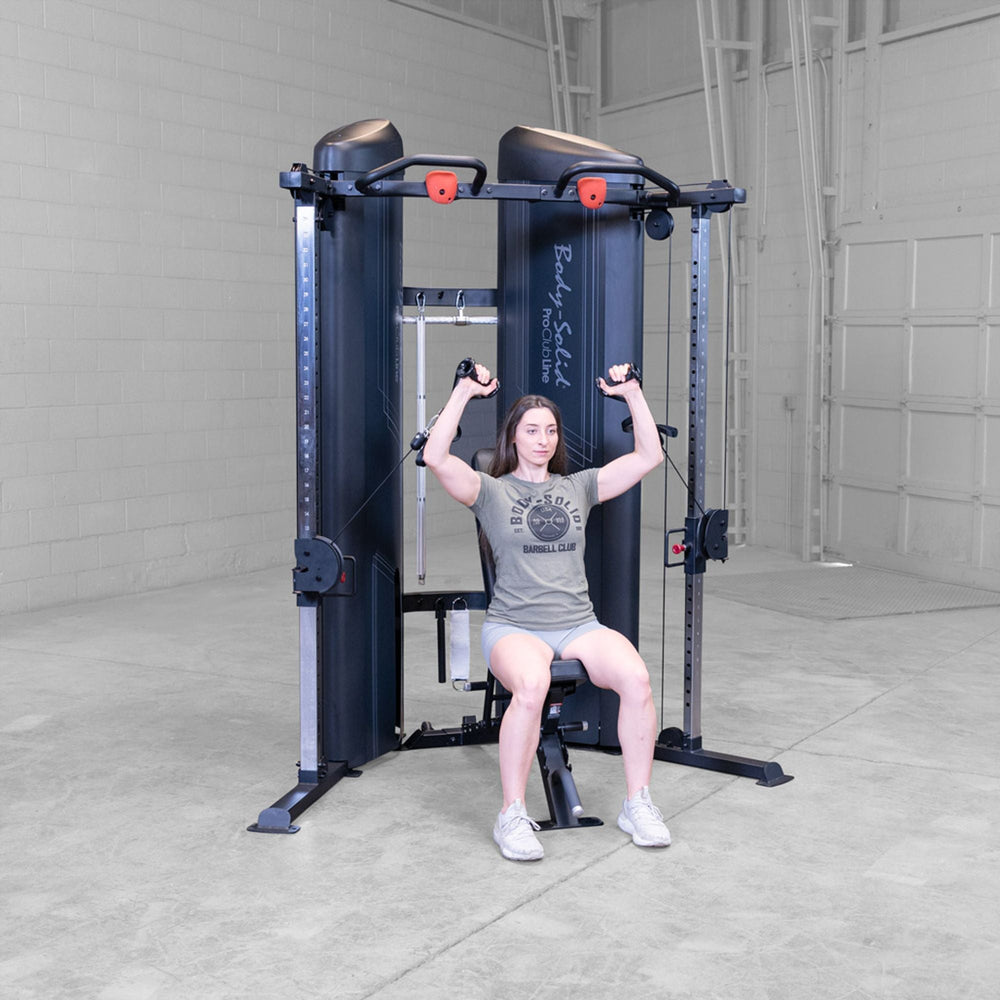Woman doing shoulder cable presses on a Body-Solid Pro ClubLine S2CCX Series II Cable Column in black