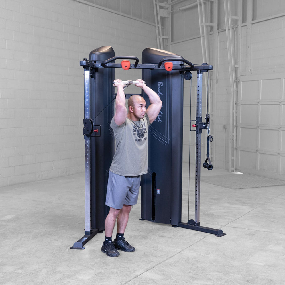Man doing overhead tricep extensions on a Body-Solid Pro ClubLine S2CCX Series II Cable Column in black