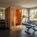 SunRay Baldwin Traditional Sauna HL200D in a home gym with exercise equipment