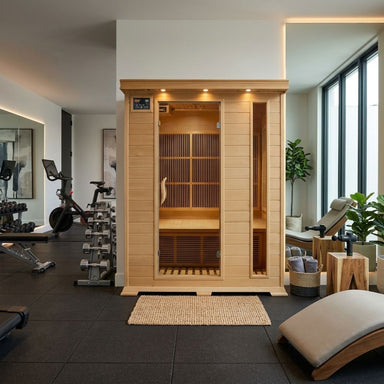 SunRay Aspen 3-Person Sauna HL300C in a modern home with exercise equipment and a couch.