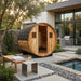 SunRay-Aurora 2-4 person Barrel Sauna in a backyard setting with a pool and outdoor furniture.