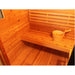 SunRay Seneca 3-Person Contemporary Outdoor Traditional Sauna with a bucket and wooden spoon on a raised platform.