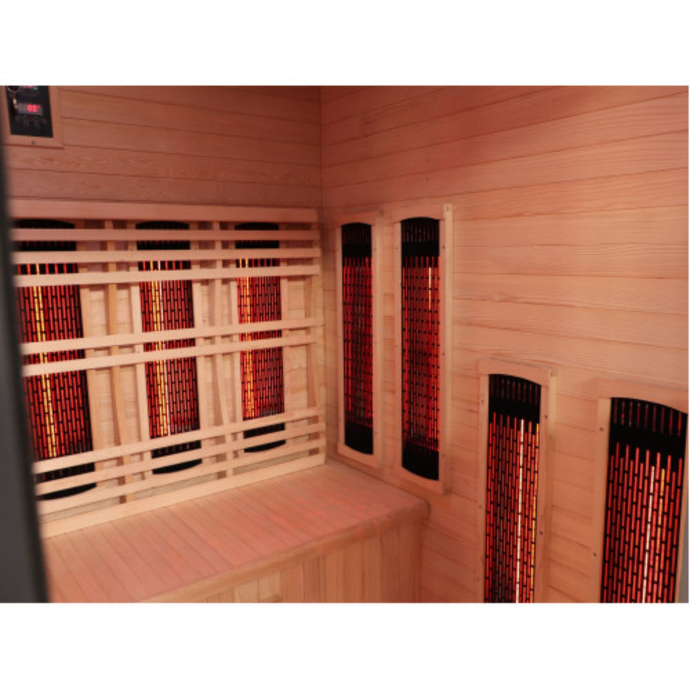 Sunray Pacific 4-Person Outdoor Infrared Sauna interior with light natural wood walls and benches, featuring multiple red and black infrared heating elements visible through slotted panels.