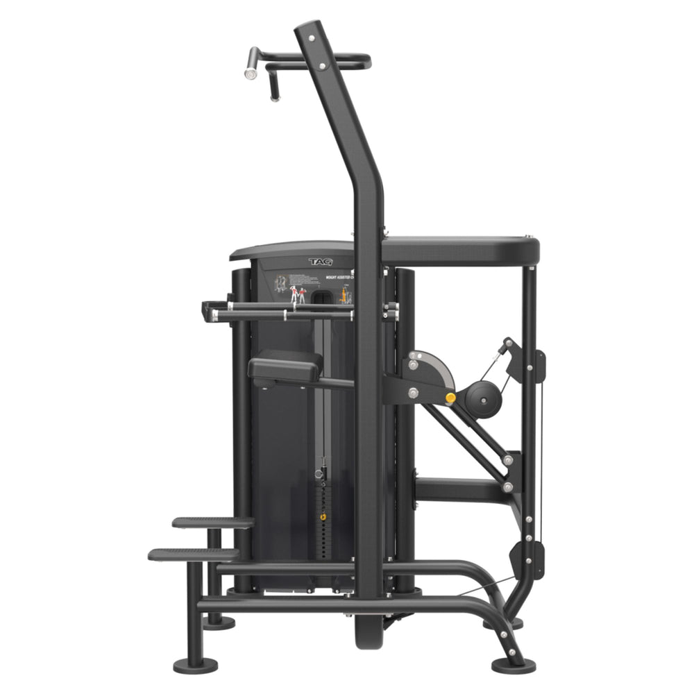 TAG Fitness Elite Chin and Dip Assist Dual Select machine side view with black frame, selectorized weight stack, assisted knee platform, and multi-grip handles.