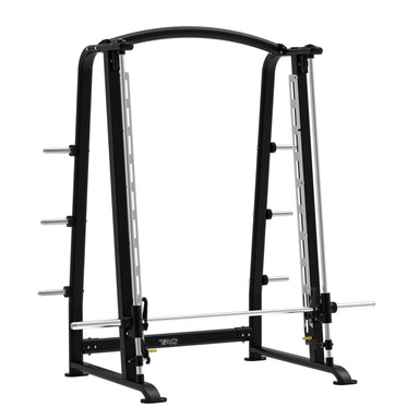TAG Fitness Elite Smith Machine with black frame, linear bearings, counterbalanced bar, dual safety stops, and integrated plate storage.
