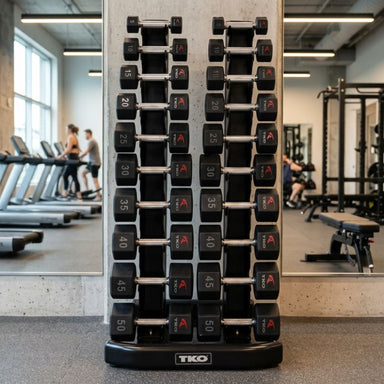 TKO 10 Pair Vertical Dumbbell Rack 840VDR10-BK in a gym with a mirror and TKO Tri-Grip Hex Dumbbell 5-50 lb Set, 816TXU