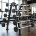TKO Barbell rack with weights in a gym setting