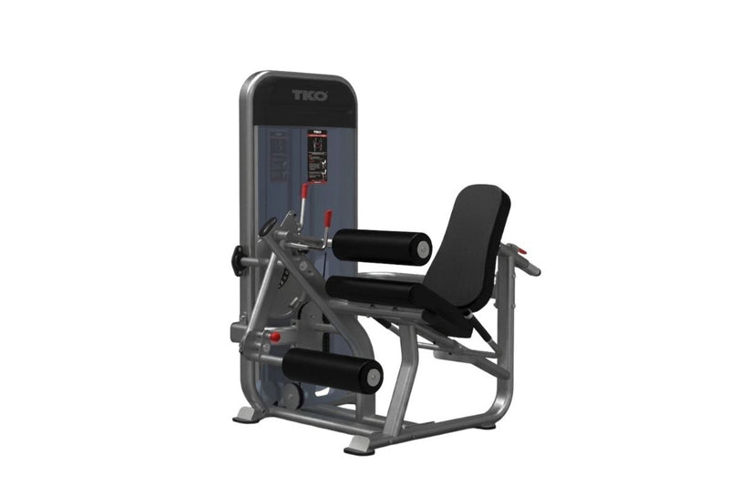 A TKO brand leg extension gym machine with a black metal frame, black padded seat and backrest, and black leg roller arms, shown on a plain white background.