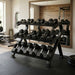 TKO Tri-Grip Rubber Hex Dumbbell Set 814TXR on TKO 3-Tier Horizontal Dumbbell Rack 890HDR-BK with weights in a home gym setting