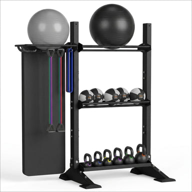 TORQUE Black metal wall base fitness storage rack with exercise balls, resistance bands, and kettlebells on a white background