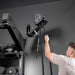 Person using a Torque Relentless Rope attached to a Torque Wall Base mount in a gym setting