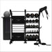 Black TORQUE-torque-group-training-station with various weights and gym tools on a white background