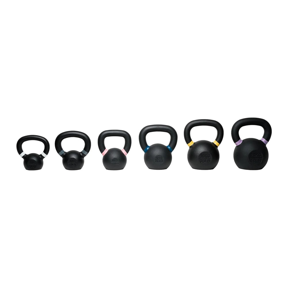 Set of black kettlebells with color-coded handles on a white background