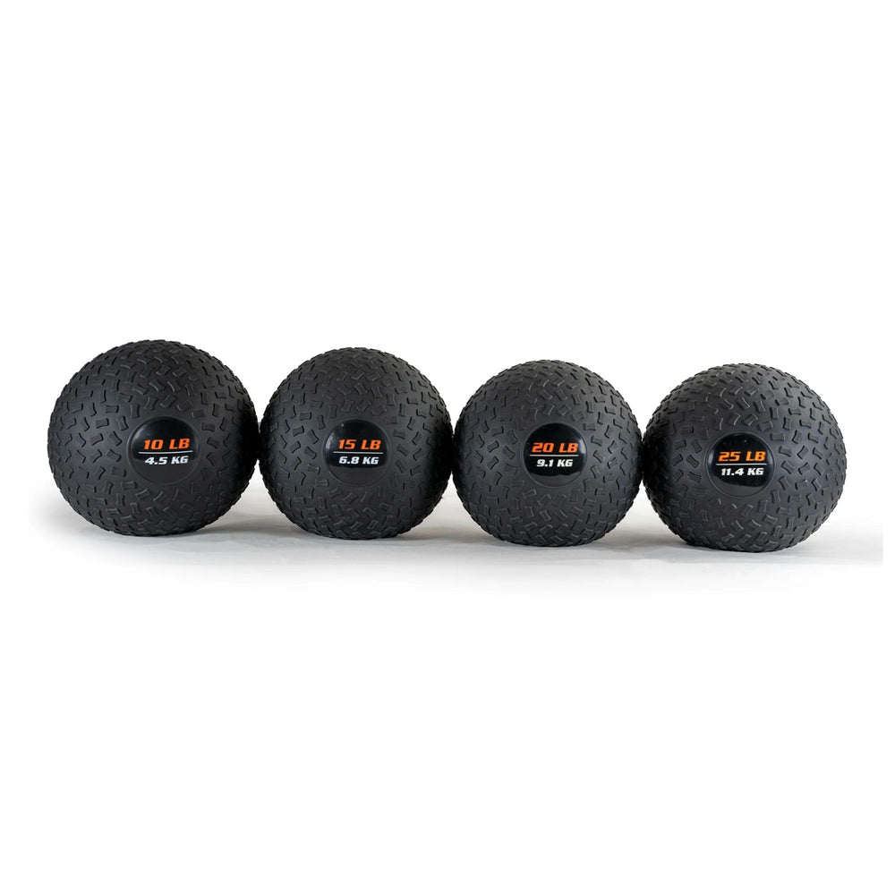 Four black slam balls with weight labels on a white background