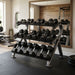 TKO Tri-Grip Rubber Hex Dumbbell Set 814TXR on TKO 3-Tier Horizontal Dumbbell Rack 890HDR with weights in a home gym setting