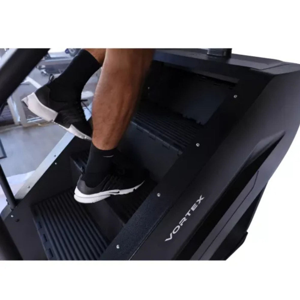 Vortex Commercial Stair Stepper with integrated TV ST4000 Close-up of feet stepping on Vortex Stair Stepper