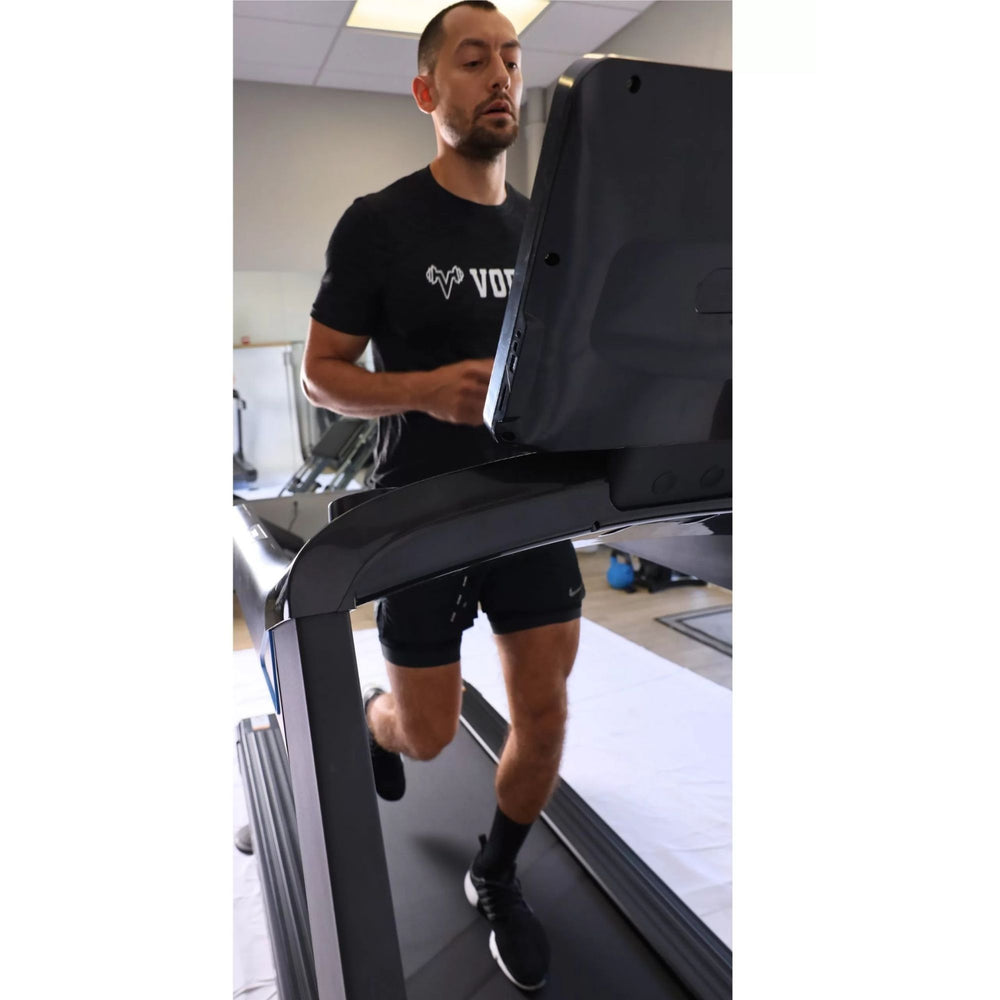 Vortex Commercial Treadmill With Integrated Tv for Streaming, Scenery and More VT5000 Man running on fitness console
