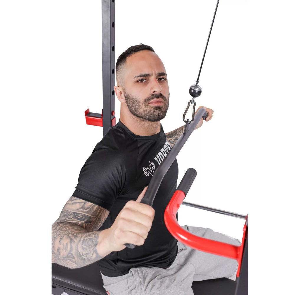 Vortex Olympic Squat Cage 1000 lb Weight Capacity Included with LAT Pulldown System RBVX10 Man using lat pulldown attachment