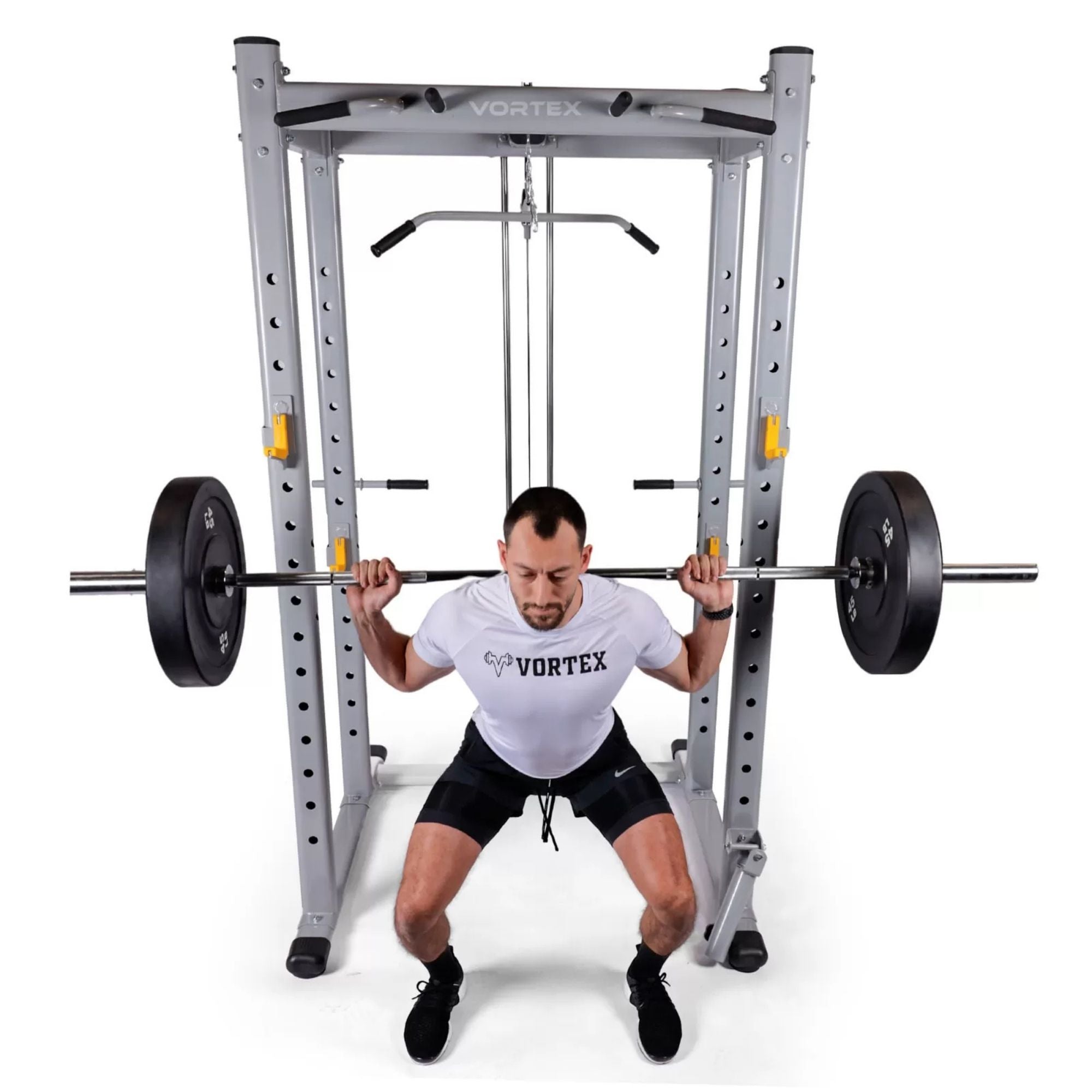 Vortex Squat Cage With High/low Pulley, Dip Attachments and Landmine SRVXG350 Man performing barbell back squat