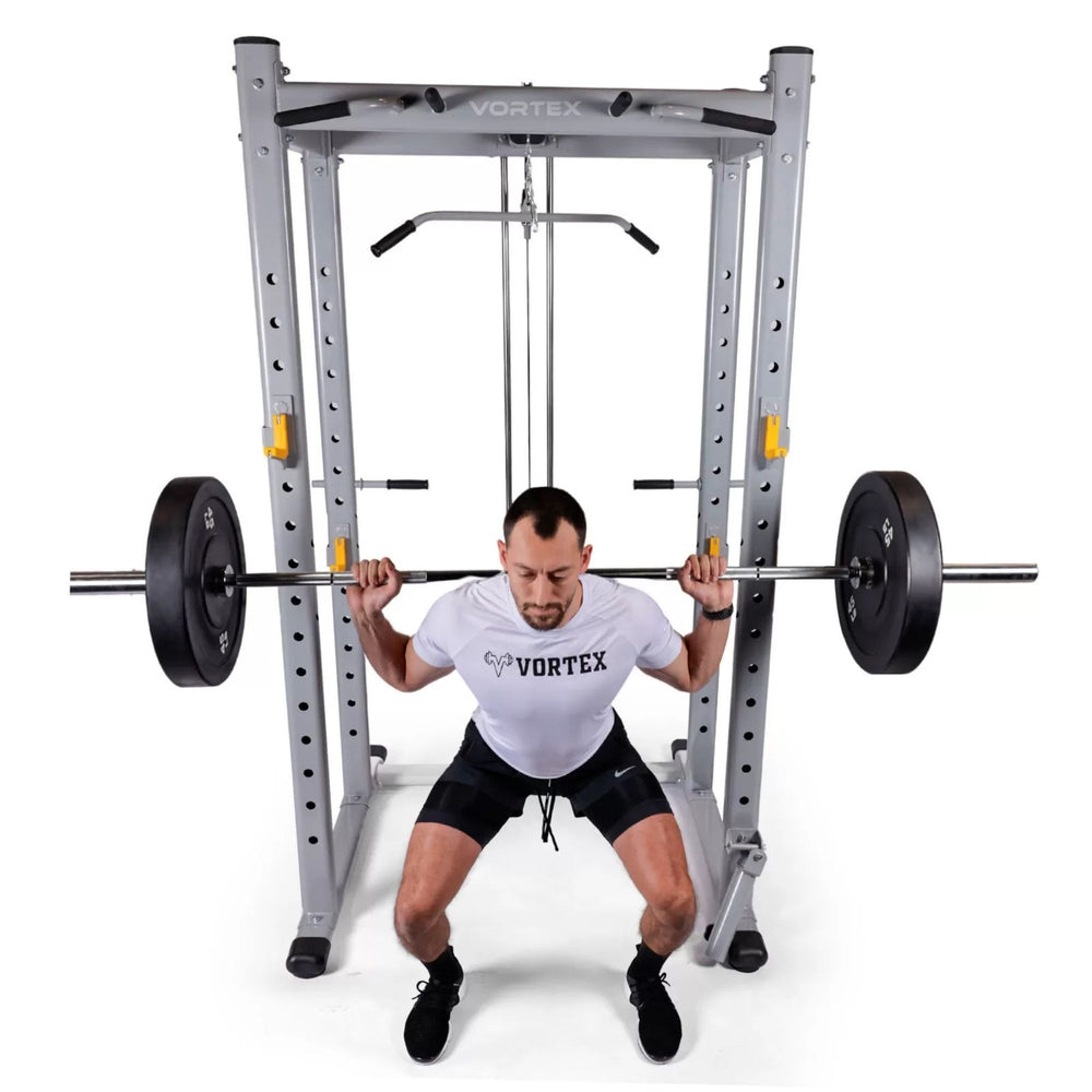 Vortex Squat Cage With High/low Pulley, Dip Attachments and Landmine SRVXG350 Man performing barbell back squat