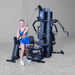 Body-Solid G9B multi-stack home gym featuring high pulley cable station for crossover and upper body training
