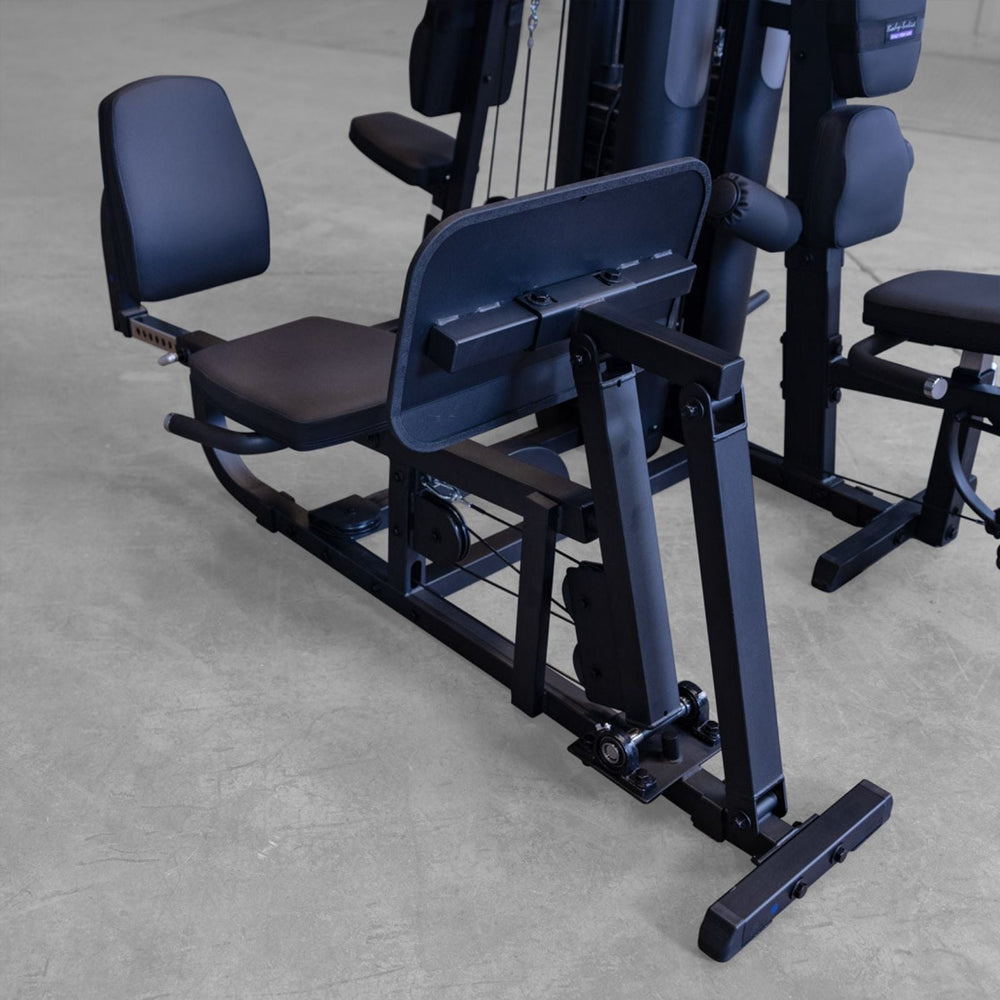 Close-up of Body-Solid G9B dual stack home gym leg press rail system and seat assembly
