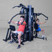 Body-Solid G9B dual stack multi-gym showing dual pec deck chest fly stations for simultaneous training
