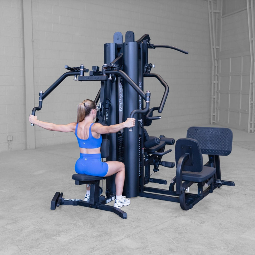 Body-Solid G9B multi-stack home gym rear angle showing pec deck station and dual weight stack towers
