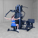 Body-Solid G9B multi-stack home gym rear angle showing pec deck station and dual weight stack towers

