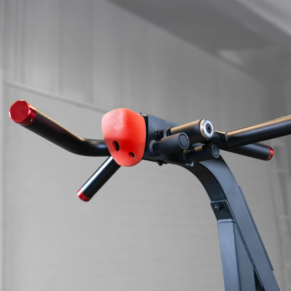 S2ACDX Series 2 Weight Assist Vertical Knee Raise Close-up of a bicycle handlebar with red grips on a blurred background