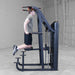 S2ACDX Series 2 Weight Assist Vertical Knee Raise Person using a black gym machine in a gray room