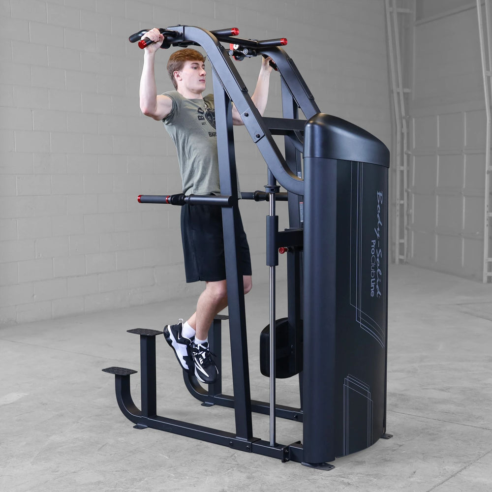 S2ACDX Series 2 Weight Assist Vertical Knee Raise Person using a black and gray exercise machine in a gym setting
