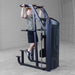 S2ACDX Series 2 Weight Assist Vertical Knee Raise Person using a black and gray exercise machine in a gym setting