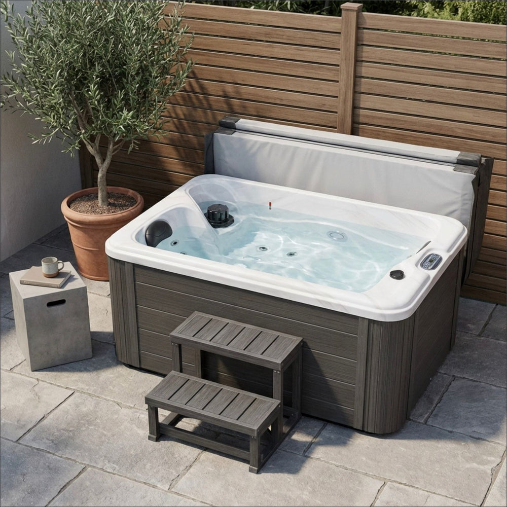 Luxury Spas Cashmere Hot tub with steps and a potted plant on a patio