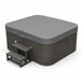 Large Denali 7 person hot tub with steps and cover over hot tub