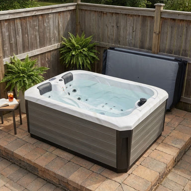 Luxury Spas Largo hot tub filled with water on a small patio