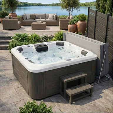 Luxury Spas Victoria 6-Person Hot Tub WS-693 CG in a home patio setting with lake in background