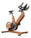 power plate rev with wood grain finish and low angle to see foot pedals and bicycle gearing