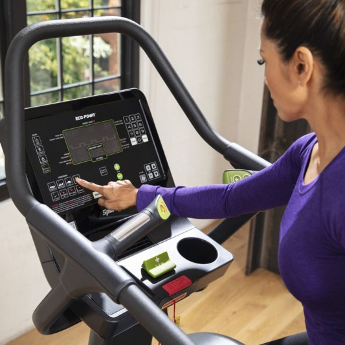 SportsArt ECO-POWR Stepper G778 console close-up with user adjusting digital display