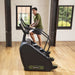 SportsArt ECO-POWR Stepper G778 commercial stair climber with male user in fitness studio