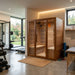 SunRay 4-Person Roslyn Sauna HL400KS in a modern home with gym equipment and a garden view.