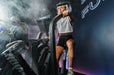 Woman riding the Torque Stealth Air Bike in a group fitness class
