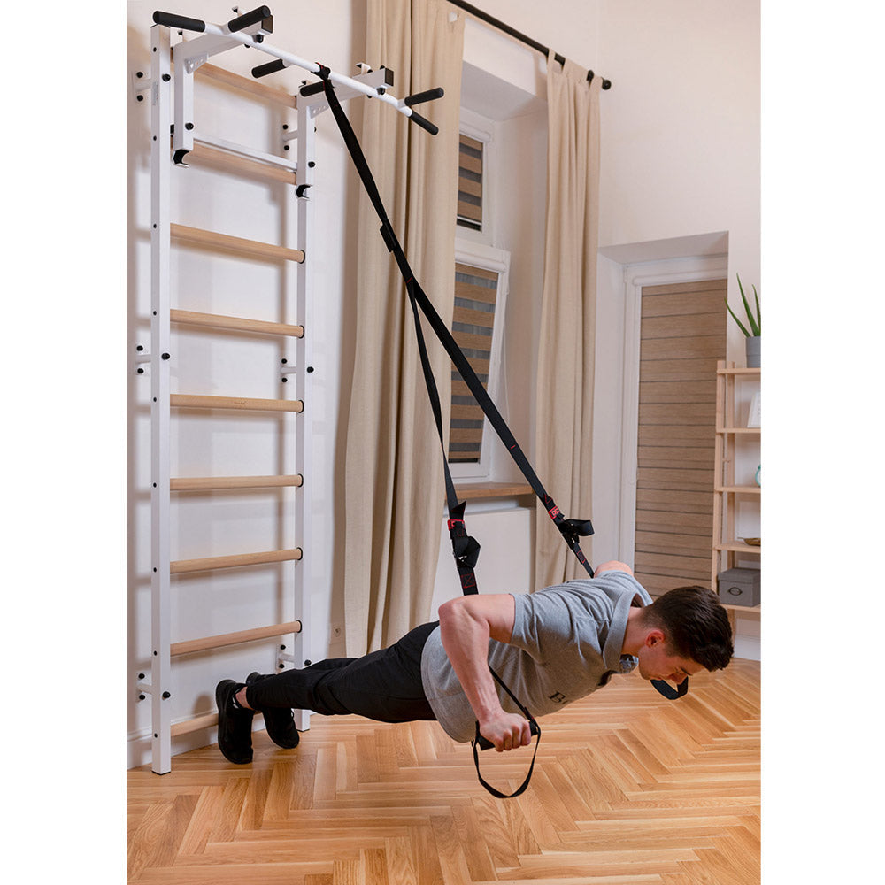 BenchK Wall Bar 711W with user using bands to exercise
