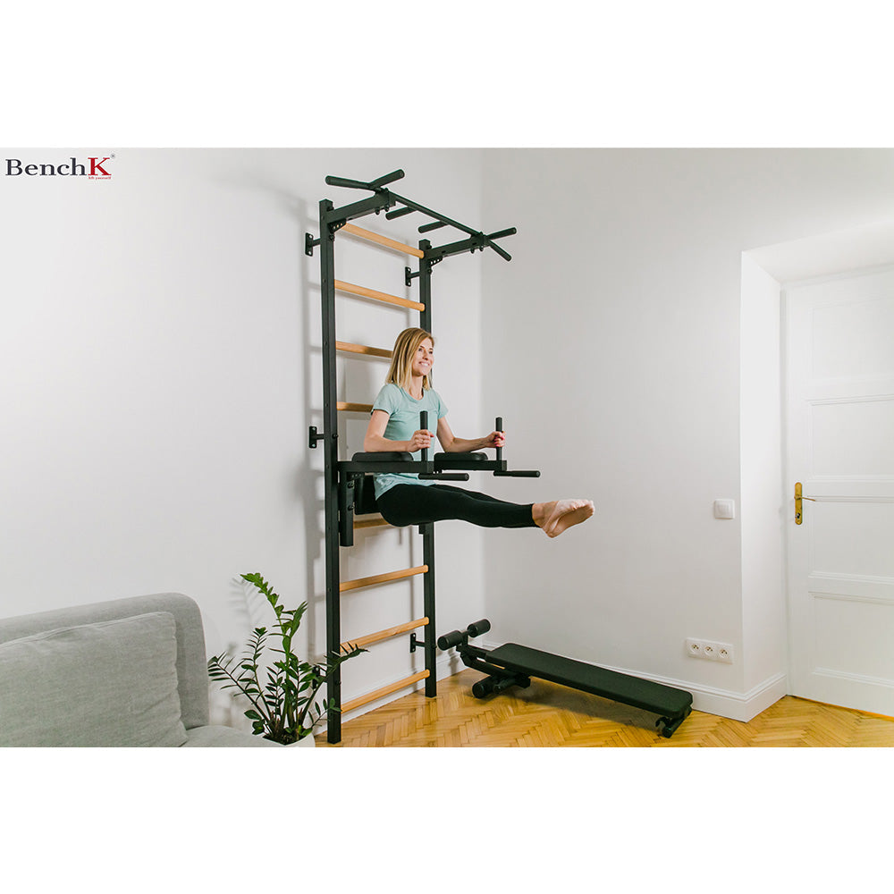 BenchK Wall Bar Set 722B inside a living room with female exercising 